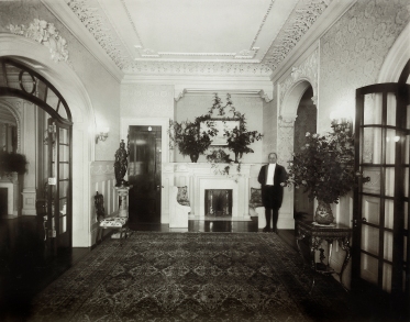 Second-floor hallway at 330 Riverside Drive, with butler. 1907. Courtesy of Brian Finnerty